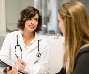 Female doctor explaining diagnosis to her female patient
