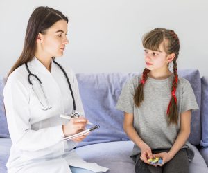 ill-girl-being-examined-by-doctor